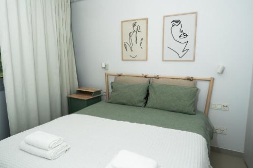 a bedroom with a bed with two towels on it at Panoramic Seaview Penthouse The Wave in Fuengirola
