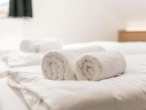 Postel nebo postele na pokoji v ubytování NRV Top 567 XL