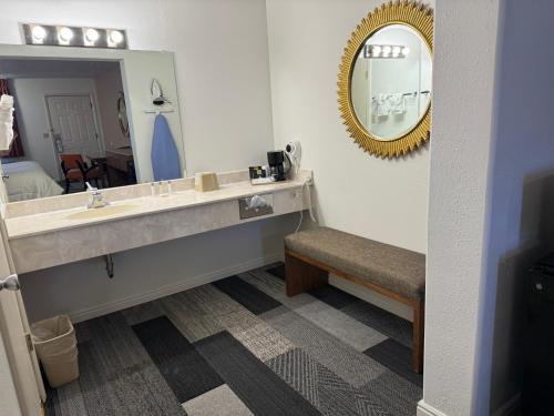 a bathroom with a sink and a mirror at Abajo Lodge in Monticello