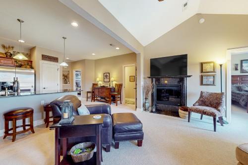 a living room with a couch and a fireplace at Relax a While in Hollister