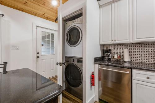 a kitchen with a washer and dryer at Urban Explorer Pad - 3BR - Backyard -Parking in Jeffersonville