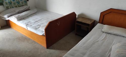 Postel nebo postele na pokoji v ubytování Lumbini Village Garden Lodge