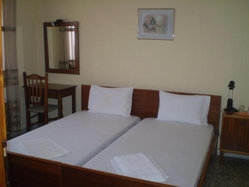 Postel nebo postele na pokoji v ubytování Hotel Apolafsi