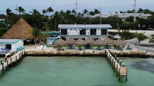 a view of a resort with a pier and water at Edgewater Lodge in Layton