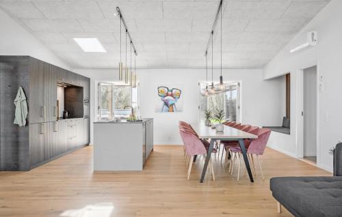 a kitchen and dining room with a table and chairs at Beautiful Home In Børkop With Kitchen in Børkop