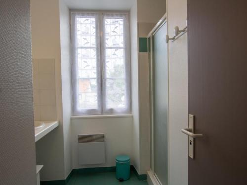 a small bathroom with a window and a toilet at Gîte spacieux au cœur du Périgord - 2 Chambres, Terrasse, Parking - FR-1-616-213 in Saint-Mesmin