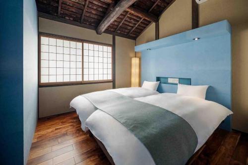 Cama o camas de una habitación en Asagi an Machiya House