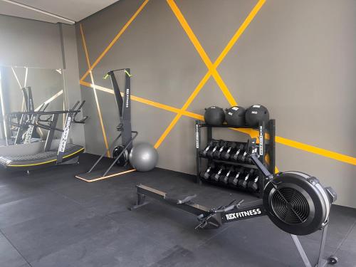 a gym with several exercise equipment in a room at Hermoso departamento Curupaú Isuto in Santa Cruz de la Sierra