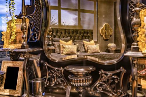 a room with a couch and a mirror at Cloud 9 in Karitane