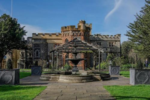 a castle with a fountain in front of it at The Seashells Whitstable in Kent