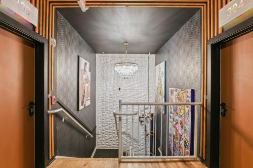 a hallway with a walk in shower in a room at Hermetic Heart Of Midtown Semblance King Bed Studio in Atlanta