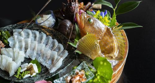 a plate of food with different types of seafood at Sennenmatsu in Imabari