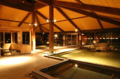 an indoor pool in a house at night at Liberty Resort 久能宿 in Shizuoka