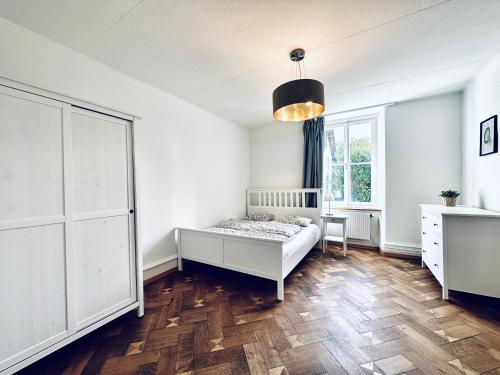 a bedroom with a bed and a window at Business Apartment in Derendingen in Derendingen