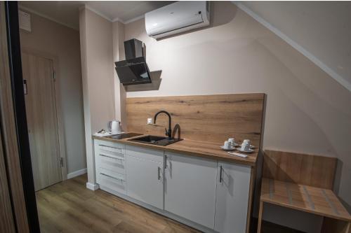 a kitchen with a sink and a counter top at Soul House Gdansk Old Town in Gdańsk