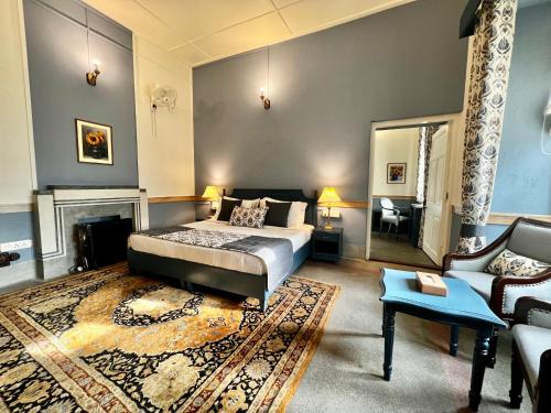 a bedroom with a bed and a living room at Brij Villa, Dalhousie - A Colonial Luxury Retreat in Dalhousie