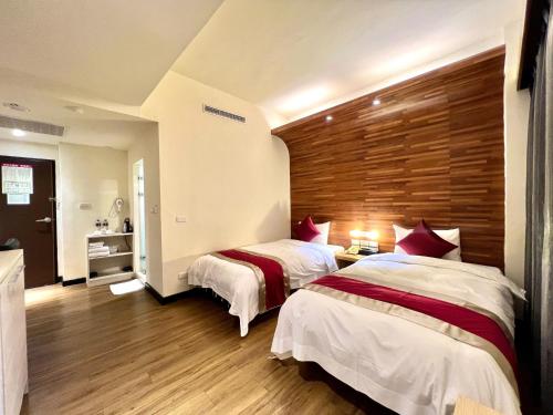 Postel nebo postele na pokoji v ubytování Zhao Lai Hotel