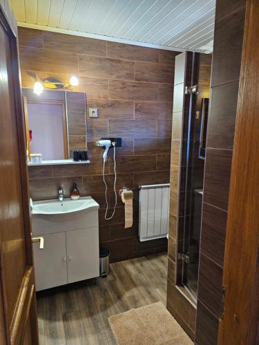 a bathroom with a sink and a mirror at Villa Szófia in Siófok