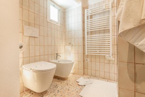 a bathroom with a toilet and a sink at La casa di Benedetta in Polignano a Mare
