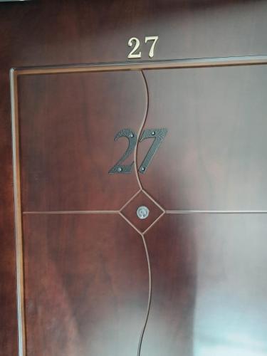 a glass door with a design on it with the number at Belveder Montenegro in Rafailovici