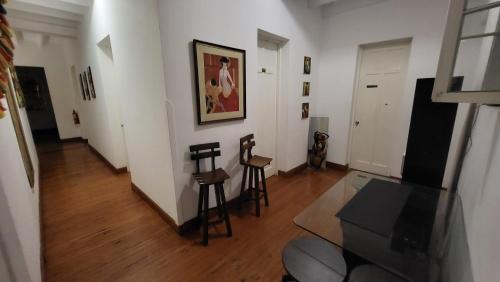 a living room with a table and two chairs at La Casona Hospedaje in Lima