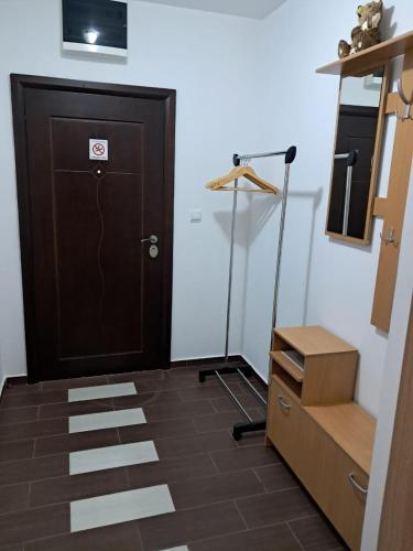 a room with a door and a dresser and a box at Belveder Montenegro in Rafailovici