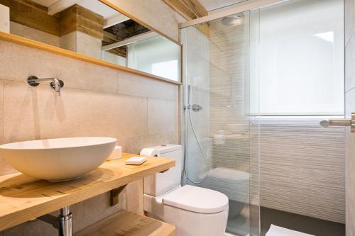 a bathroom with a sink and a glass shower at Luderna - Apartamento Cap de Aran A2 in Baqueira-Beret