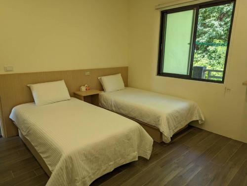 Ένα ή περισσότερα κρεβάτια σε δωμάτιο στο Ran Ran 29 Guest House