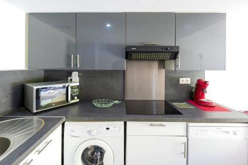 Η κουζίνα ή μικρή κουζίνα στο Appartement de charme - spa privé