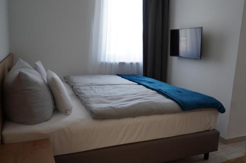 Ένα ή περισσότερα κρεβάτια σε δωμάτιο στο Eco Motel