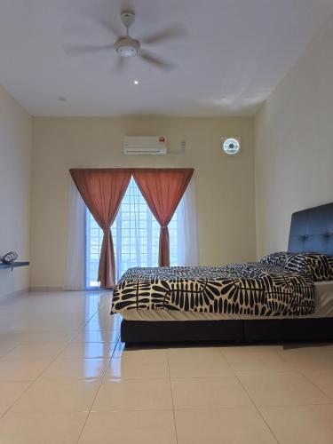 a bedroom with two beds and a window at Homestay Sitiawan 53 in Sitiawan