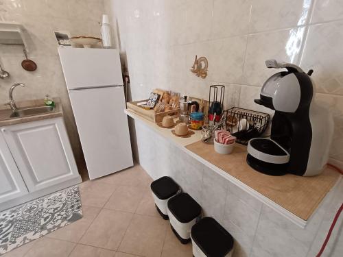 a kitchen with a counter with a coffee maker on it at Stella House in Fasano