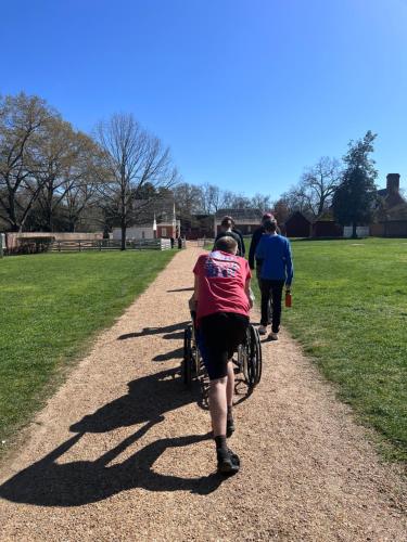 a person walking a bike down a path at Silver Mountain Resort in Kellogg