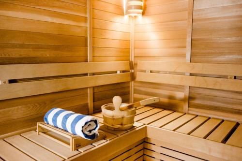 a sauna with a blue and white towel in it at Seda Vertis North in Manila