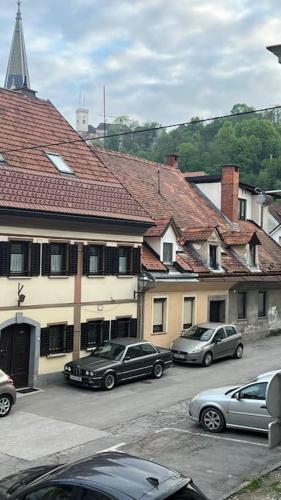 a group of cars parked in front of a building at The Wasabi Chill in Ljubljana