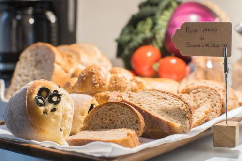 a tray of bread with a face made out of bread at Family Affair Luxury Rooms&Suites in Palermo