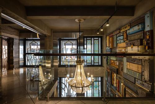a lobby with a chandelier in a building at BlueSky Hotel in Taichung