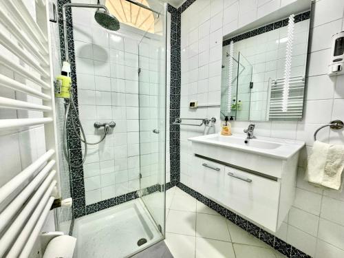 a bathroom with a shower and a sink at COSY Apartment in Sidi Bou Said Village in Sidi Bou Saïd