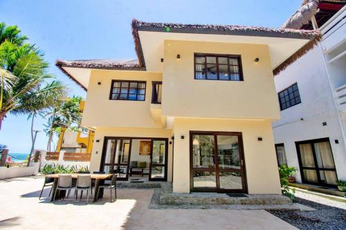 a villa with a view of the ocean at Hey Jude Bulabog Beachfront Residence in Boracay