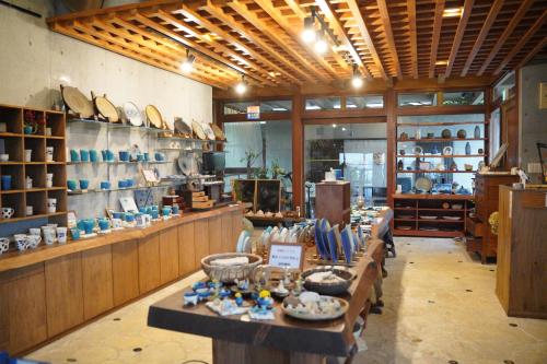 a store with a lot of items on display at ホテルコンドミニアム土花土花 in Onna