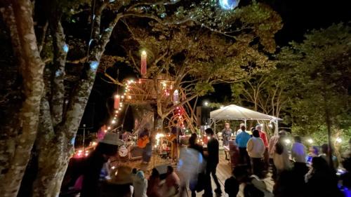 a group of people standing around a market at night at Shimanto Yamamizuki - Vacation STAY 36953v in Shimanto