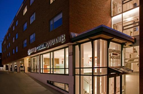 a building with glass windows on the side of it at Harvard Square Hotel in Cambridge