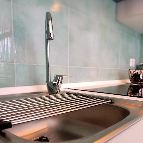a kitchen sink with a faucet on top of it at L'Eden di Turo Brand New Loft in Conca dei Marini