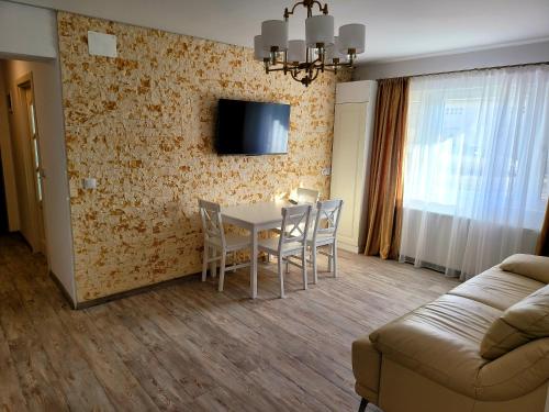 TV a/nebo společenská místnost v ubytování R&R Apartament