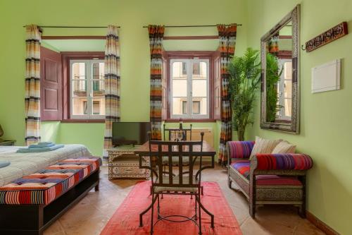 a bedroom with a bed and a desk and a chair at Casa da Moura in Lagos