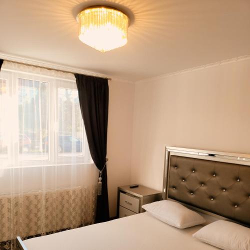 Postel nebo postele na pokoji v ubytování R&R Apartament