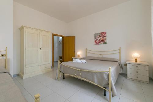 Ein Bett oder Betten in einem Zimmer der Unterkunft Agriturismo I Debbi - L'Olivo