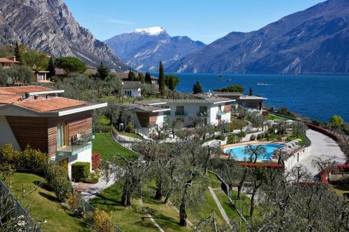 a villa with a view of the lake and mountains at Hotel Atilius in Limone sul Garda