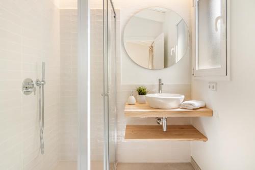 a bathroom with a sink and a mirror at Villas Menorca Sur in Son Bou