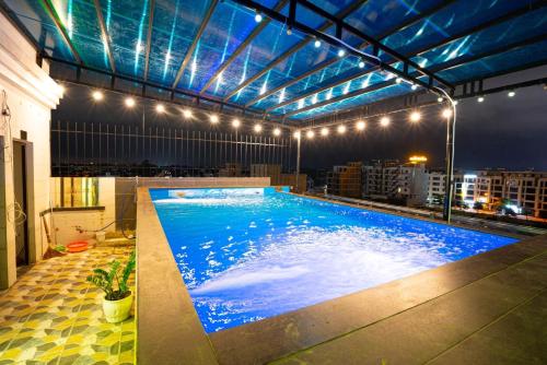 a large swimming pool on the roof of a building at Melanta Hotel - FLC Sầm Sơn in Sầm Sơn